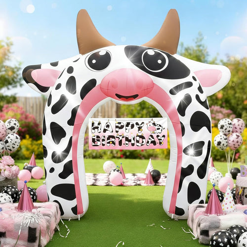 Black and white cow print inflatable archway at a farm party